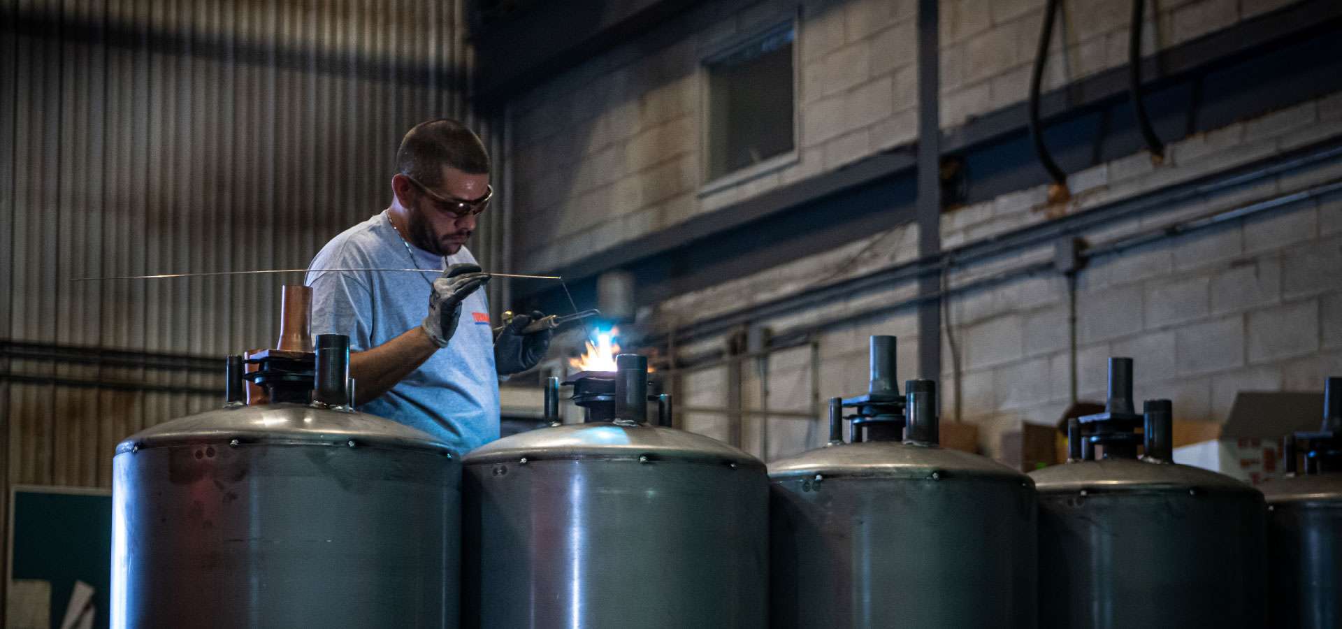 A Thermo 2000 welder working on an indirect water heater